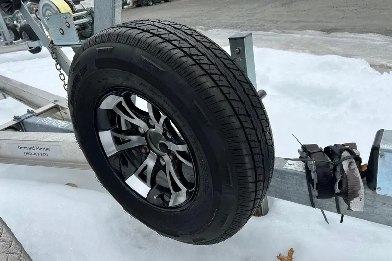 Slide: The Image of Trailer wheel on snow, Boston Whaler 250 Outrage, 2020 model. - 63