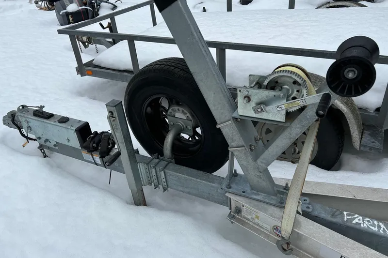 Slide: The Image of Trailer for 2020 Boston Whaler 250 Outrage in snowy setting. - 65