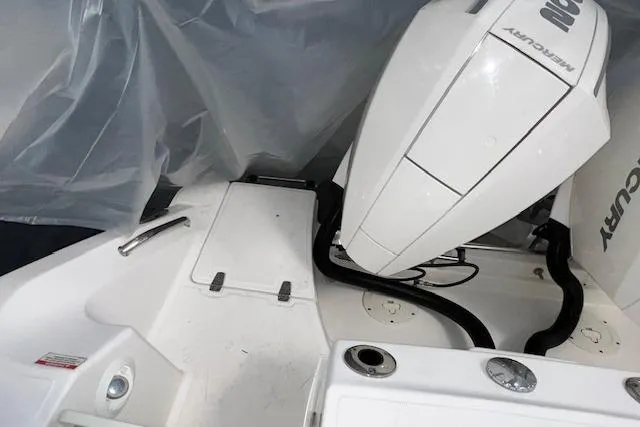 Slide: The Image of 2020 Boston Whaler 250 Outrage boat with Mercury engine, covered in protective plastic. - 7