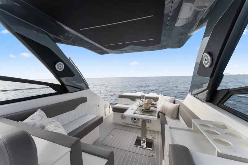 Slide: The Image of Luxurious 2025 Valiatt 380GT yacht interior with ocean view, featuring elegant seating and dining area. - 14