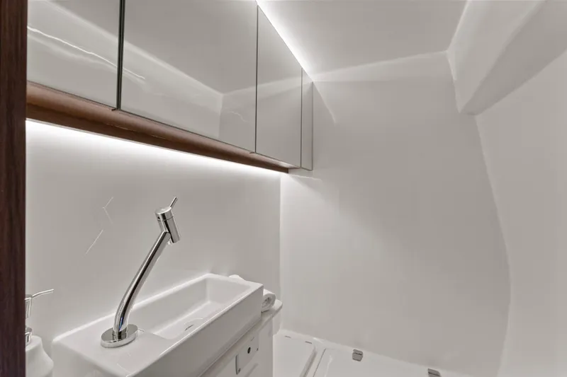 Slide: The Image of Modern bathroom in 2025 Valiatt 380GT yacht with sleek sink and mirrored cabinets. - 22