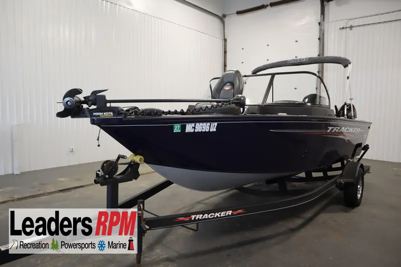 The Image of 2023 Tracker Pro Guide V-175 WT boat on trailer in indoor showroom. - 1