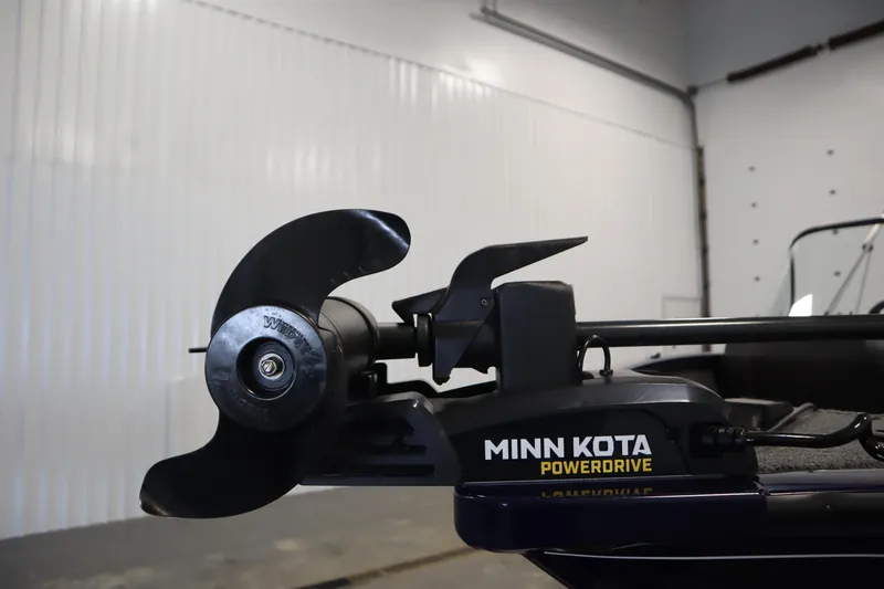 Slide: The Image of Minn Kota PowerDrive motor on 2023 Tracker Pro Guide V-175 WT boat in a garage. - 13