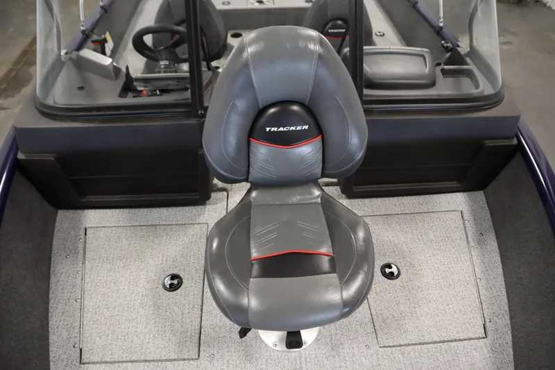 Slide: The Image of 2023 Tracker Pro Guide V-175 WT boat interior with gray captain's chair and console. - 16