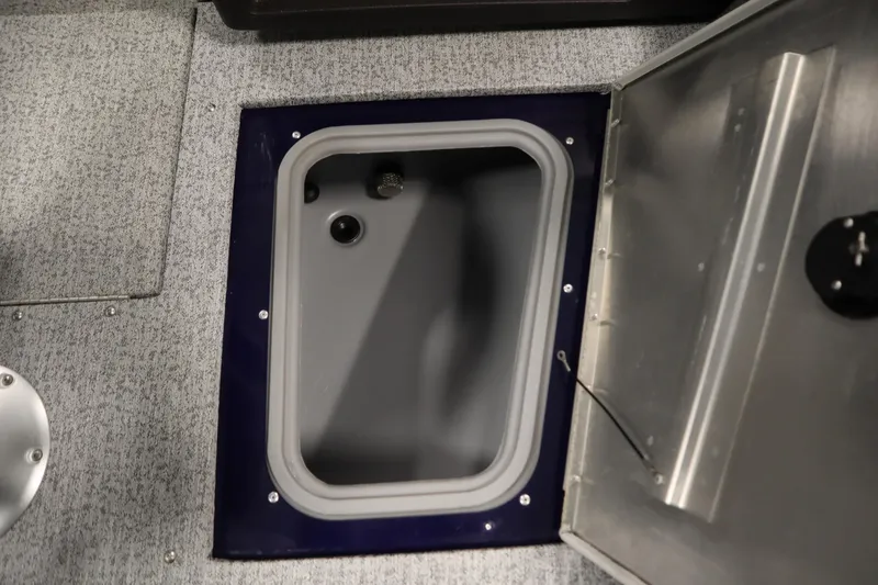 Slide: The Image of 2023 Tracker Pro Guide V-175 WT boat storage compartment with open hatch. - 18