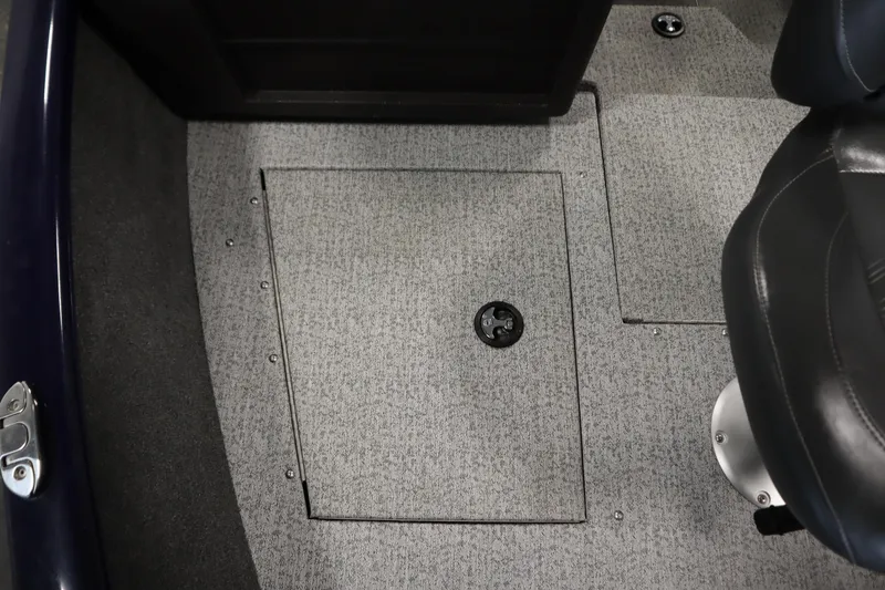 Slide: The Image of 2023 Tracker Pro Guide V-175 WT boat interior with carpeted floor and storage compartment. - 19