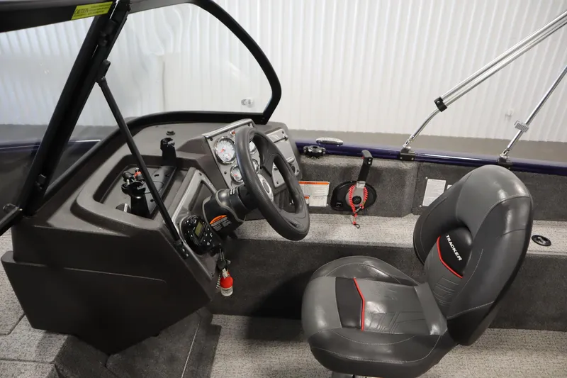 Slide: The Image of 2023 Tracker Pro Guide V-175 WT boat interior with steering wheel and seat. - 24
