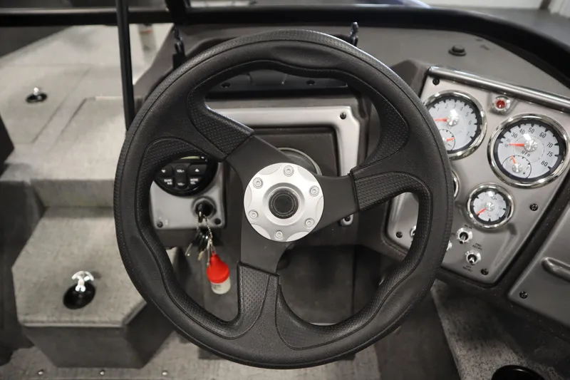 Slide: The Image of Steering wheel and dashboard of 2023 Tracker Pro Guide V-175 WT boat. - 26