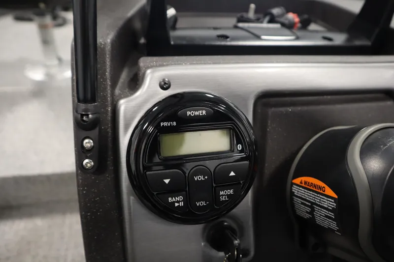 Slide: The Image of 2023 Tracker Pro Guide V-175 WT dashboard with control panel and warning label. - 27