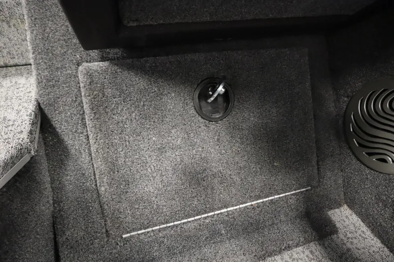 Slide: The Image of 2023 Tracker Pro Guide V-175 WT boat interior with carpeted floor and storage compartment. - 31