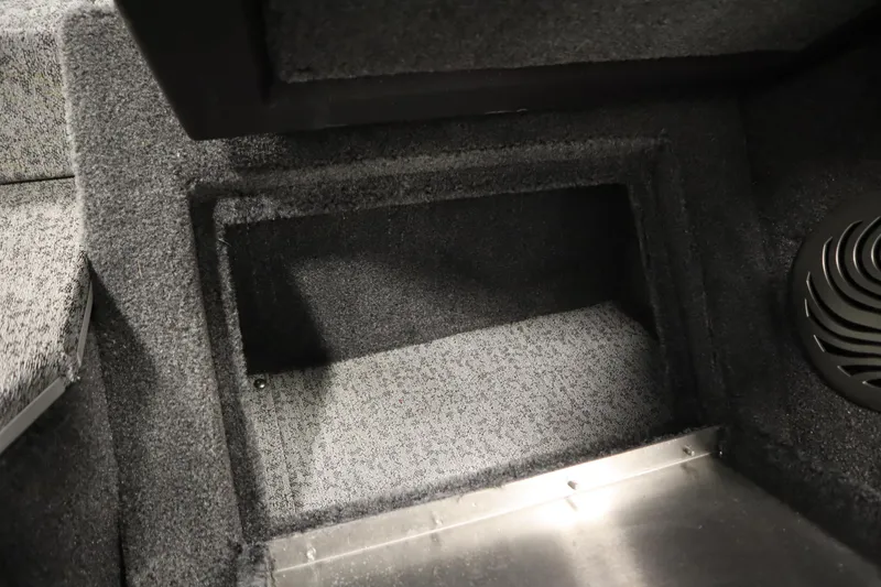 Slide: The Image of 2023 Tracker Pro Guide V-175 WT interior storage compartment with carpeted finish. - 32