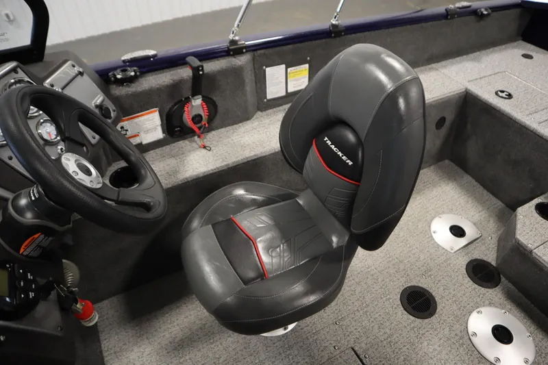 Slide: The Image of 2023 Tracker Pro Guide V-175 WT boat interior with steering wheel and cushioned seat. - 33