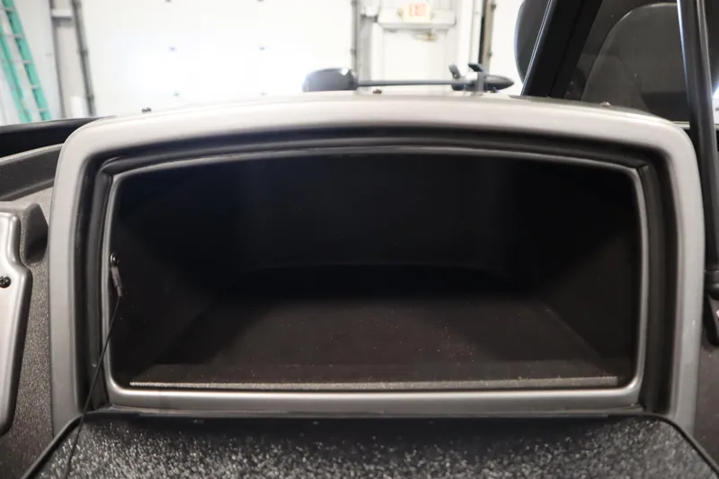 Slide: The Image of 2023 Tracker Pro Guide V-175 WT dashboard compartment, empty and open. - 37