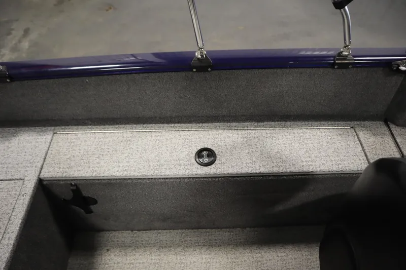 Slide: The Image of 2023 Tracker Pro Guide V-175 WT interior storage compartment with gray carpet finish. - 42