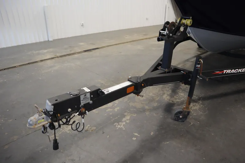 Slide: The Image of Trailer hitch of 2023 Tracker Pro Guide V-175 WT boat in a garage setting. - 59