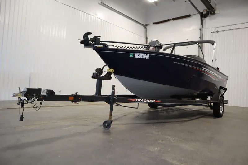 Slide: The Image of 2023 Tracker Pro Guide V-175 WT boat on trailer in indoor storage. - 60