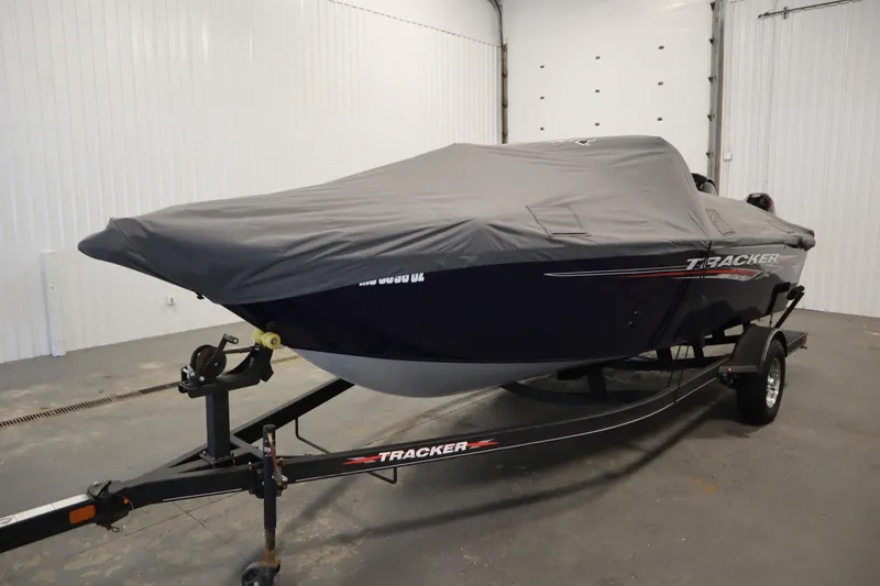Slide: The Image of 2023 Tracker Pro Guide V-175 WT boat with cover on trailer in garage. - 62