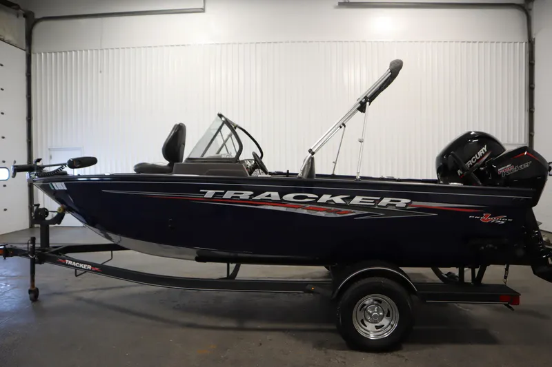 Slide: The Image of 2023 Tracker Pro Guide V-175 WT boat on trailer in indoor setting. - 8