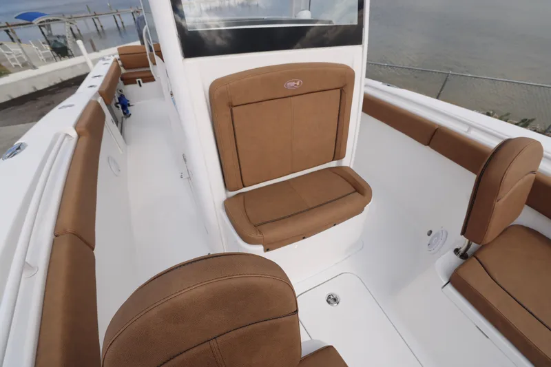 Slide: The Image of 2022 Sea Hunt Gamefish 27 Forward Seating with brown cushioned seats. - 10