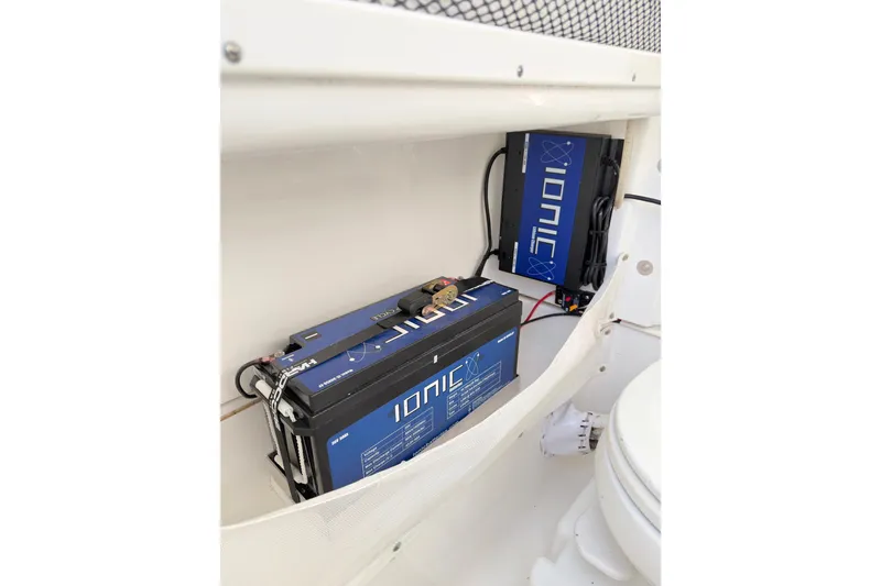 Slide: The Image of 2022 Sea Hunt Gamefish 27 boat with Ionic battery setup in storage compartment. - 12