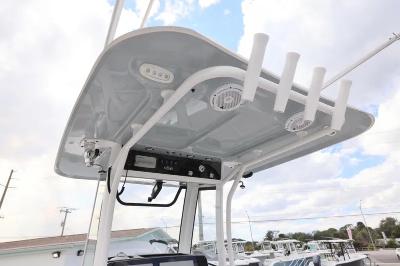 Slide: The Image of 2022 Sea Hunt Gamefish 27 boat's T-top with rod holders and speakers. - 15