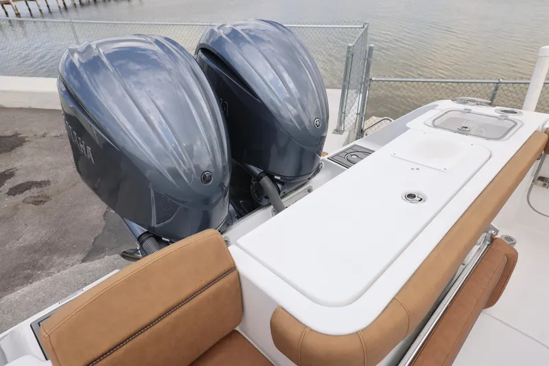 Slide: The Image of 2022 Sea Hunt Gamefish 27 with dual outboard engines and forward seating. - 19
