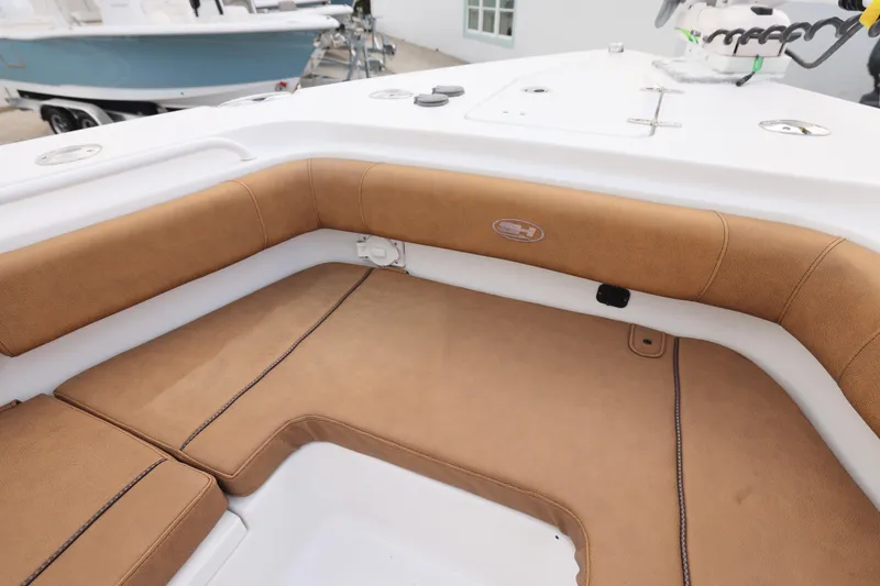 Slide: The Image of 2022 Sea Hunt Gamefish 27 Forward Seating with tan upholstery and white deck. - 25