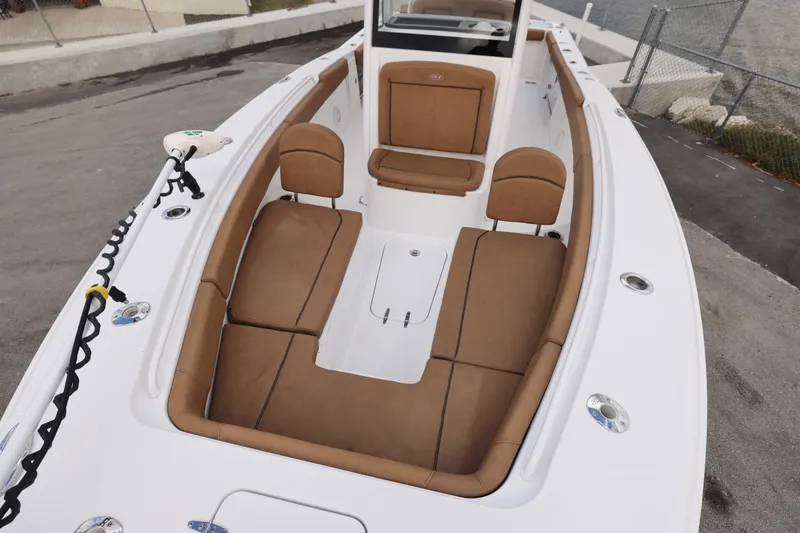 Slide: The Image of 2022 Sea Hunt Gamefish 27 Forward Seating with tan cushions and spacious layout. - 4