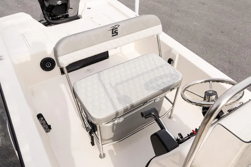 Slide: The Image of 2026 Carolina Skiff E20 JVX CC boat interior with steering wheel and seating. - 10