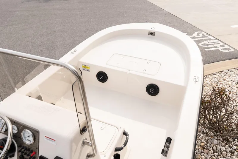 Slide: The Image of 2026 Carolina Skiff E20 JVX CC boat interior, featuring console and seating area. - 11