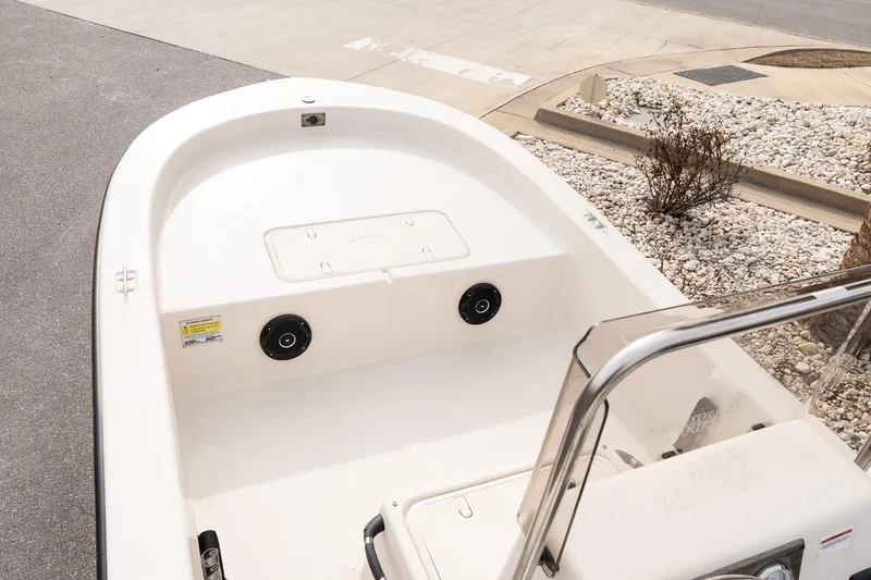 Slide: The Image of 2026 Carolina Skiff E20 JVX CC boat interior with white deck and console. - 12