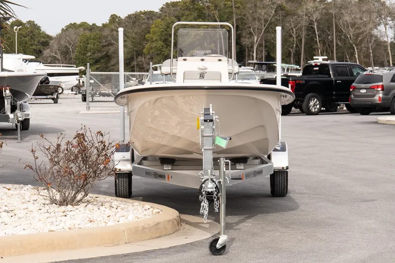 Slide: The Image of 2026 Carolina Skiff E20 JVX CC boat on trailer in parking lot. - 3