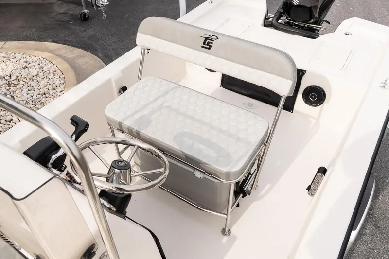 Slide: The Image of 2026 Carolina Skiff E20 JVX CC boat interior with steering wheel and seating. - 9