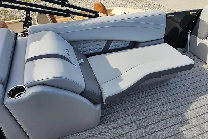 Slide: The Image of Luxurious seating on 2026 SunCatcher Fusion 324SS boat with adjustable lounge and cup holders. - 18
