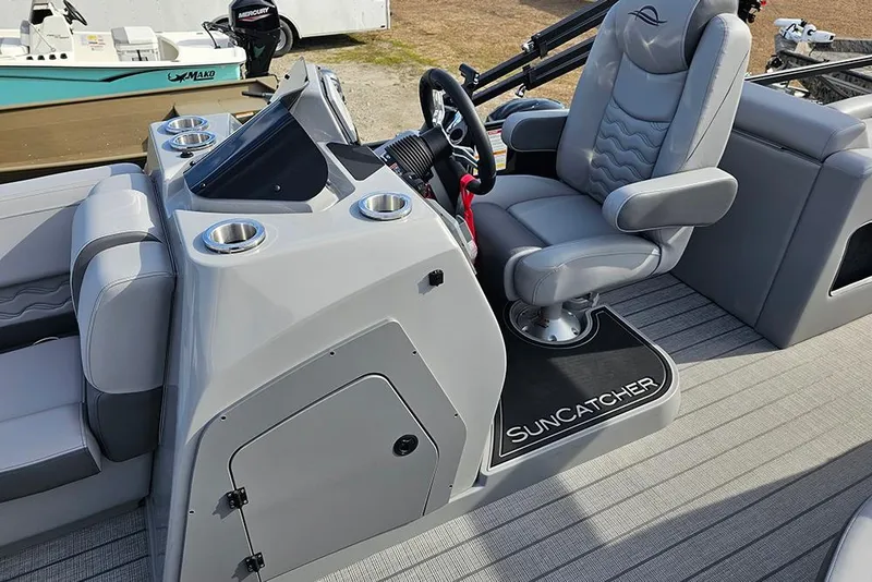 Slide: The Image of 2026 SunCatcher Fusion 324SS boat interior with sleek gray seating and modern dashboard. - 21