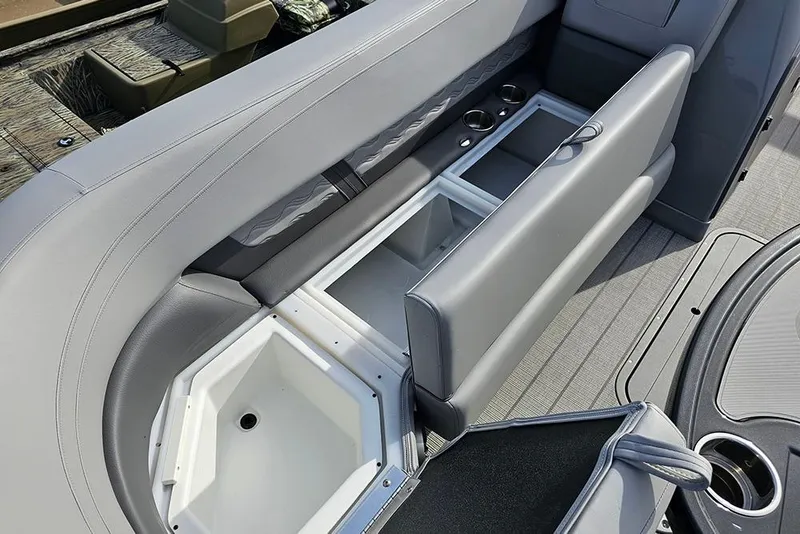 Slide: The Image of Interior view of 2026 SunCatcher Fusion 324SS boat with open storage compartments. - 26