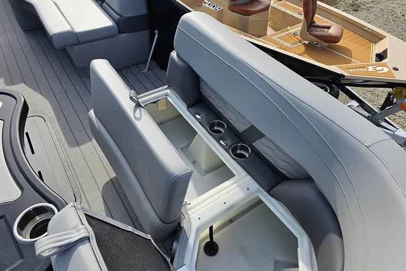 Slide: The Image of 2026 SunCatcher Fusion 324SS boat interior with gray seating and cup holders. - 27