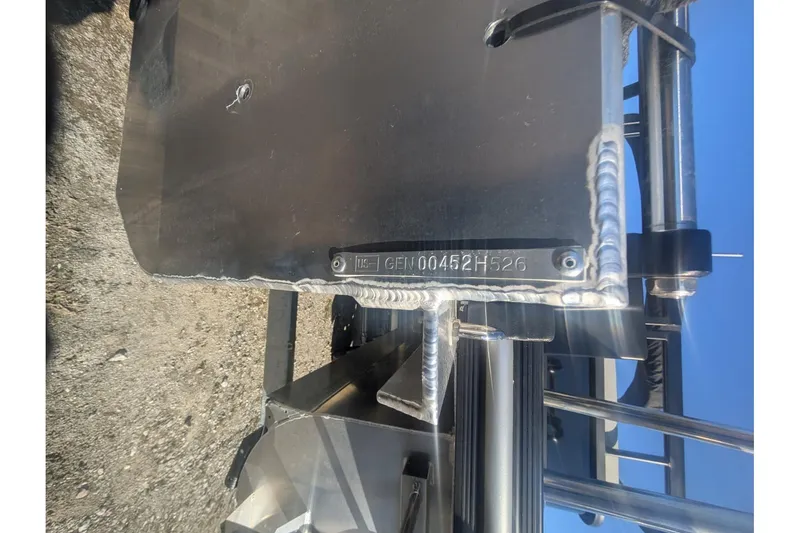 Slide: The Image of Close-up of SunCatcher Fusion 324SS 2026 boat hull with visible serial number. - 31