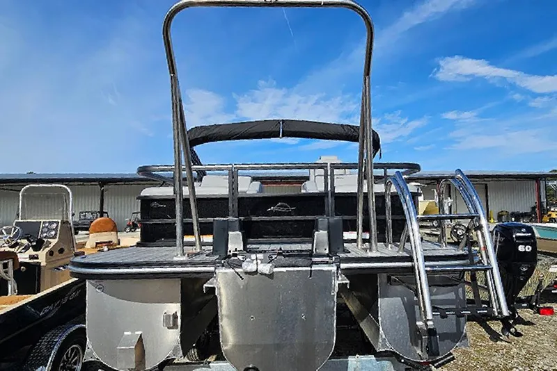 Slide: The Image of 2026 SunCatcher Fusion 324SS pontoon boat, rear view with ladder and railing. - 6