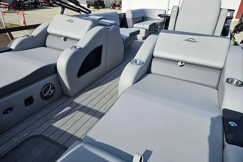 Slide: The Image of 2026 SunCatcher Fusion 324SS boat interior with luxurious gray seating and cup holders. - 7