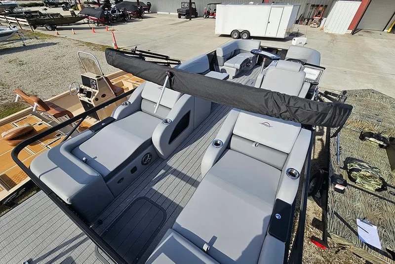 Slide: The Image of 2026 SunCatcher Fusion 324SS pontoon boat with sleek gray seating and modern design. - 8