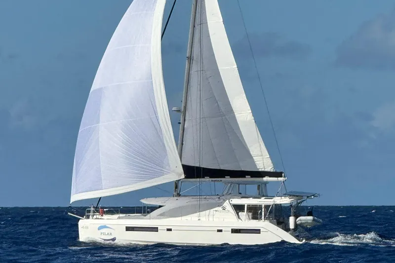 The Image of Sailing catamaran Leopard 48, 2015 model, cruising on open ocean with full sails. - 0