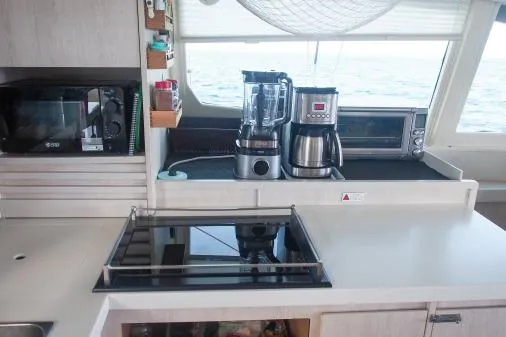 Slide: The Image of Modern kitchen on 2015 Leopard 48 yacht with appliances and ocean view. - 11