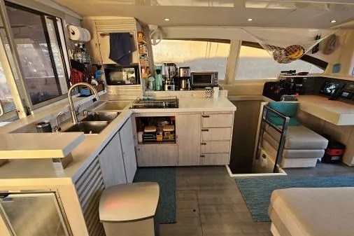 Slide: The Image of Modern kitchen interior on a 2015 Leopard 48 yacht, featuring sleek cabinetry and appliances. - 12