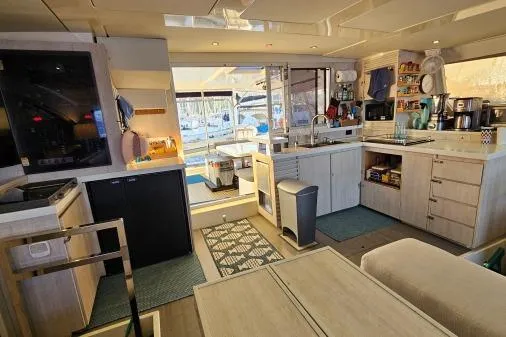 Slide: The Image of Luxurious 2015 Leopard 48 yacht interior with modern kitchen and spacious living area. - 15