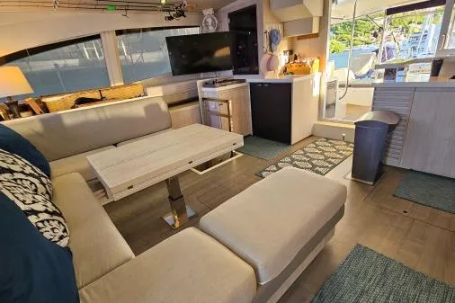 Slide: The Image of Luxurious interior of a 2015 Leopard 48 yacht with modern furnishings and ample seating. - 17