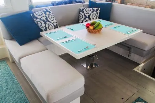 Slide: The Image of Luxurious dining area in 2015 Leopard 48 yacht with modern decor and fruit centerpiece. - 21