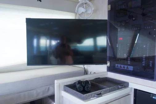 Slide: The Image of Interior of 2015 Leopard 48 yacht with TV, control panel, and binoculars. - 24