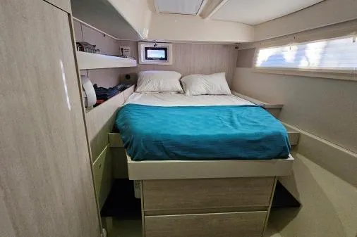 Slide: The Image of Cozy bedroom in 2015 Leopard 48 yacht with double bed and natural light. - 27