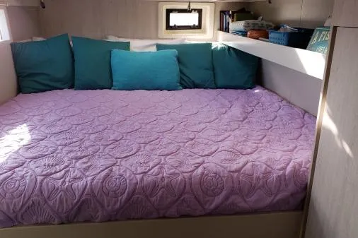 Slide: The Image of Cozy Leopard 48 yacht cabin with purple quilt and teal pillows, 2015 model. - 29